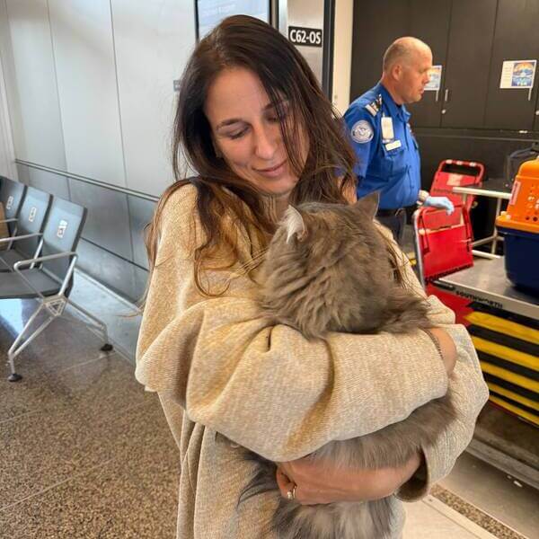 Pet nanny escorting a dog through the airport for safe travel